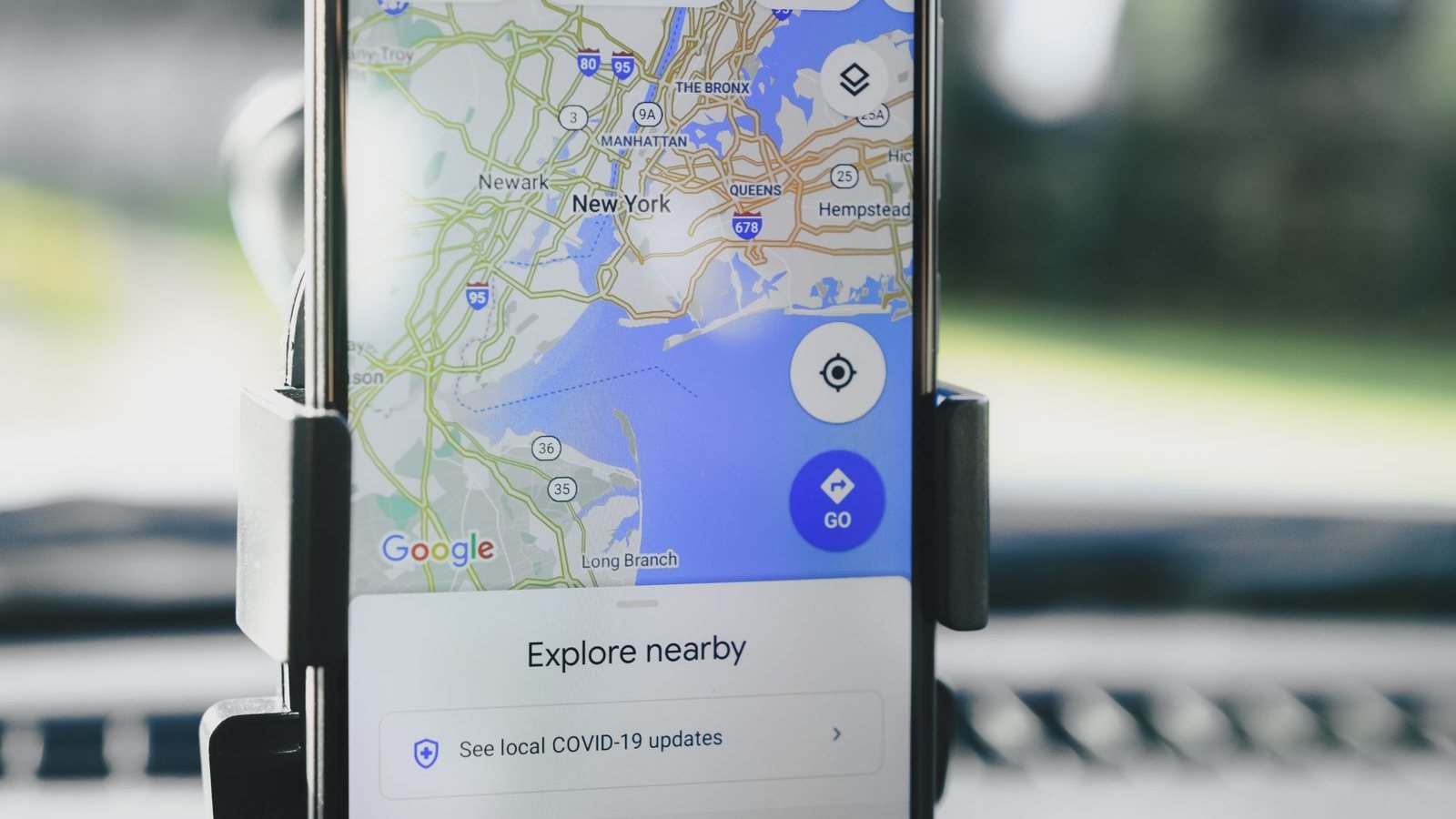 Google Maps open on a phone mounted in a car