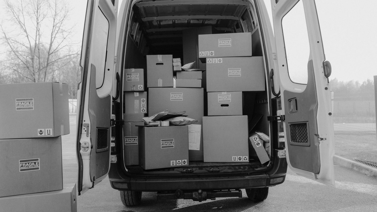Cardboard boxes stacked inside a delivery van